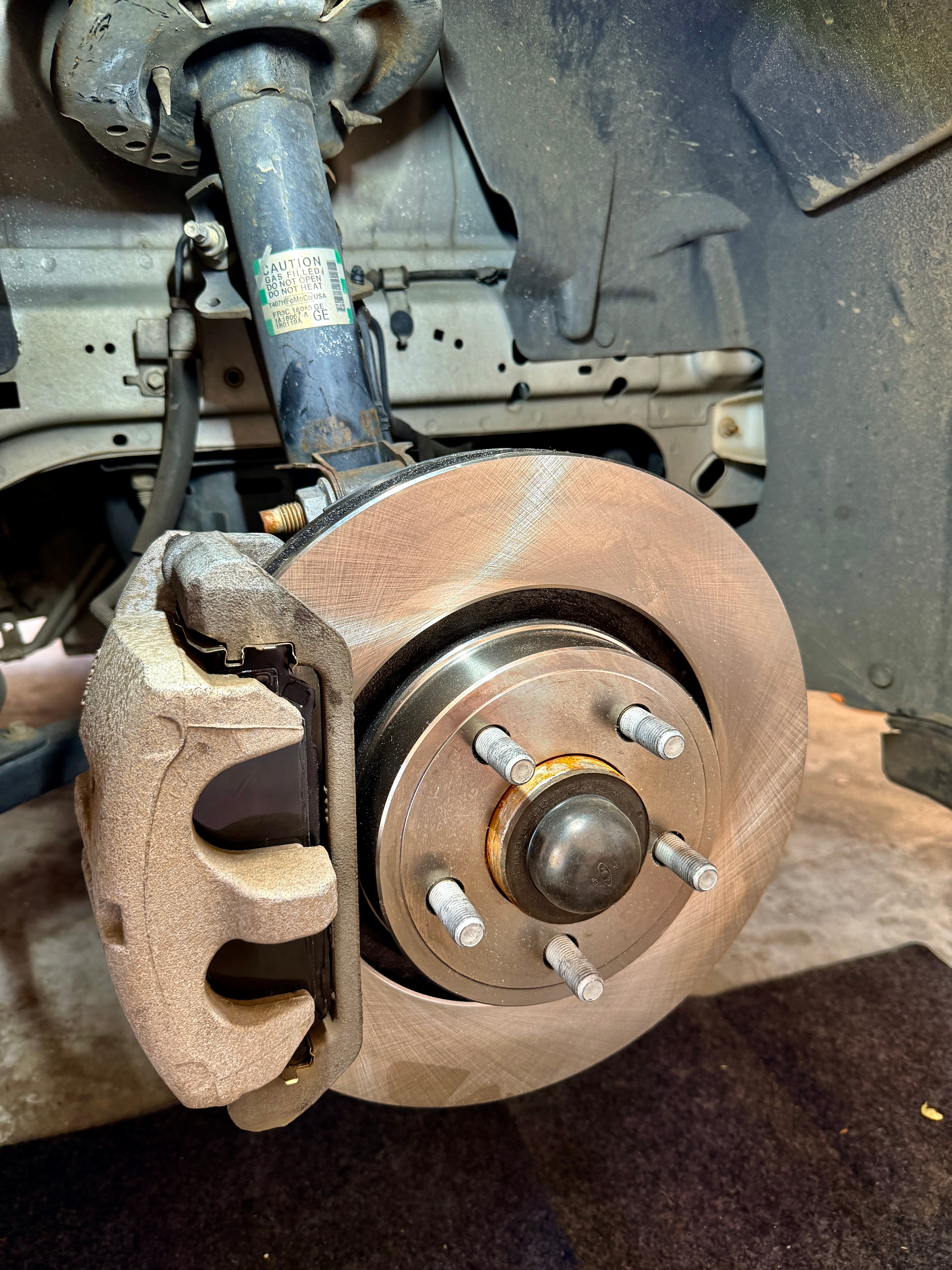 Brake rotor and caliper during a repair by Joey